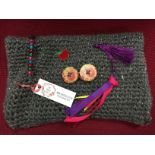 Twiddle Muff in a lovely knitted material for people living with dementia.