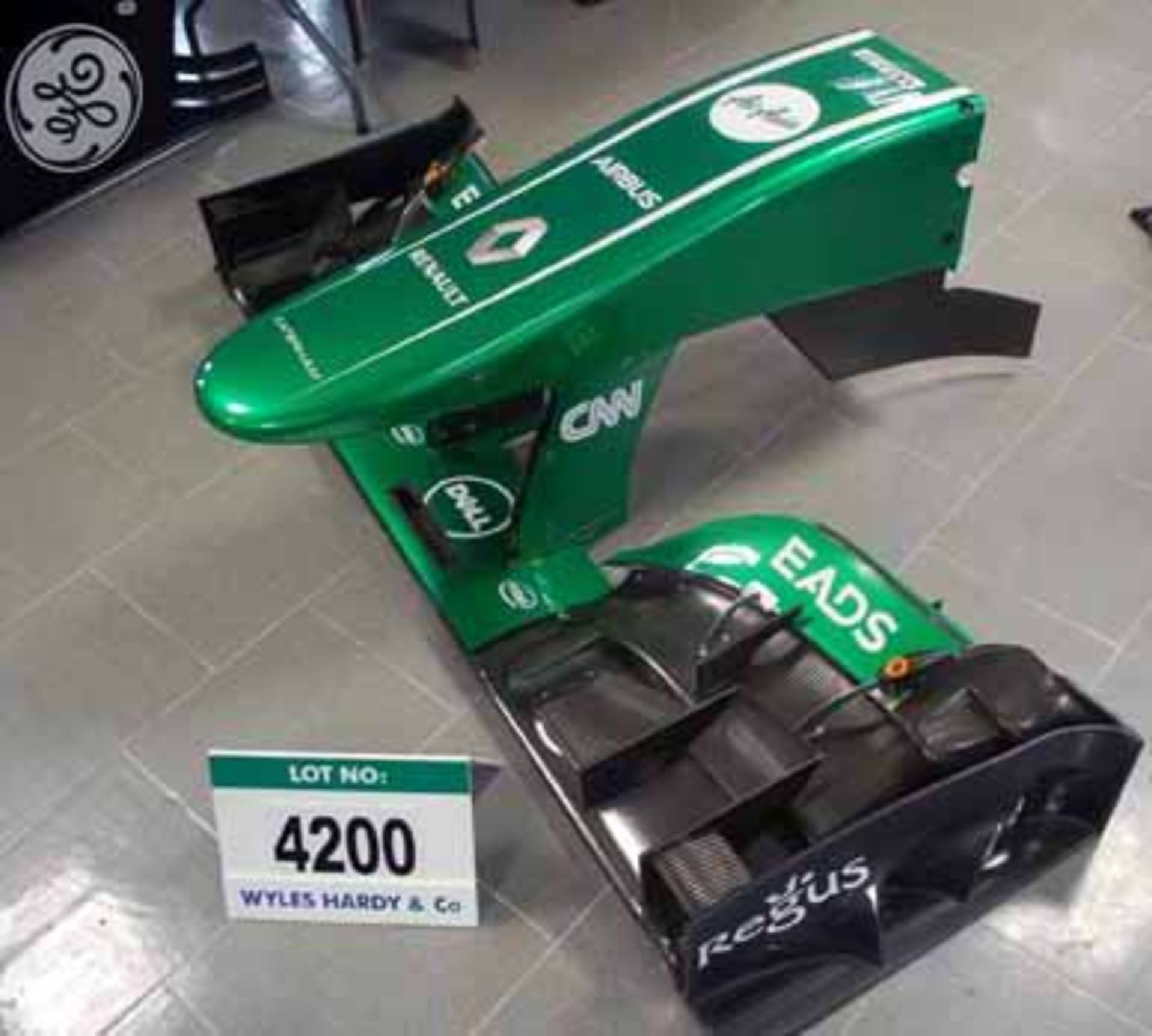 A CATERHAM F1 2011 Nose Box in 2013 CATERHAM Livery mounted on 2013 Front Wing Main Plane with AIR