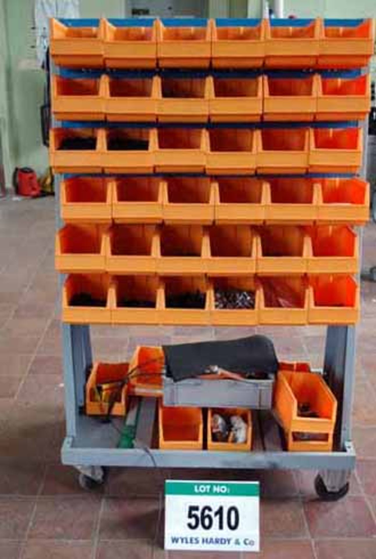 A Mobile Grey & Blue Steel Parts Rack, with Forty Five Orange Plastic Demountable Parts Bins &