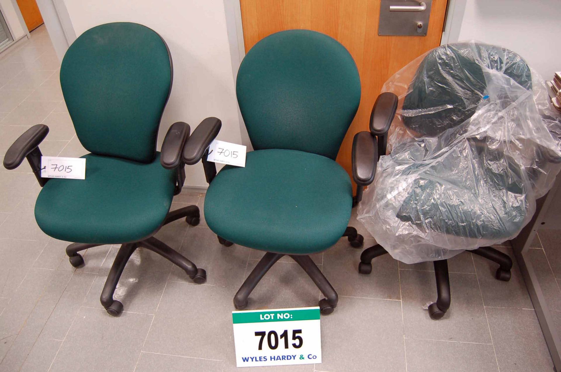 Three Green Cloth Upholstered Elbow Swivel Chairs  Want it shipped?