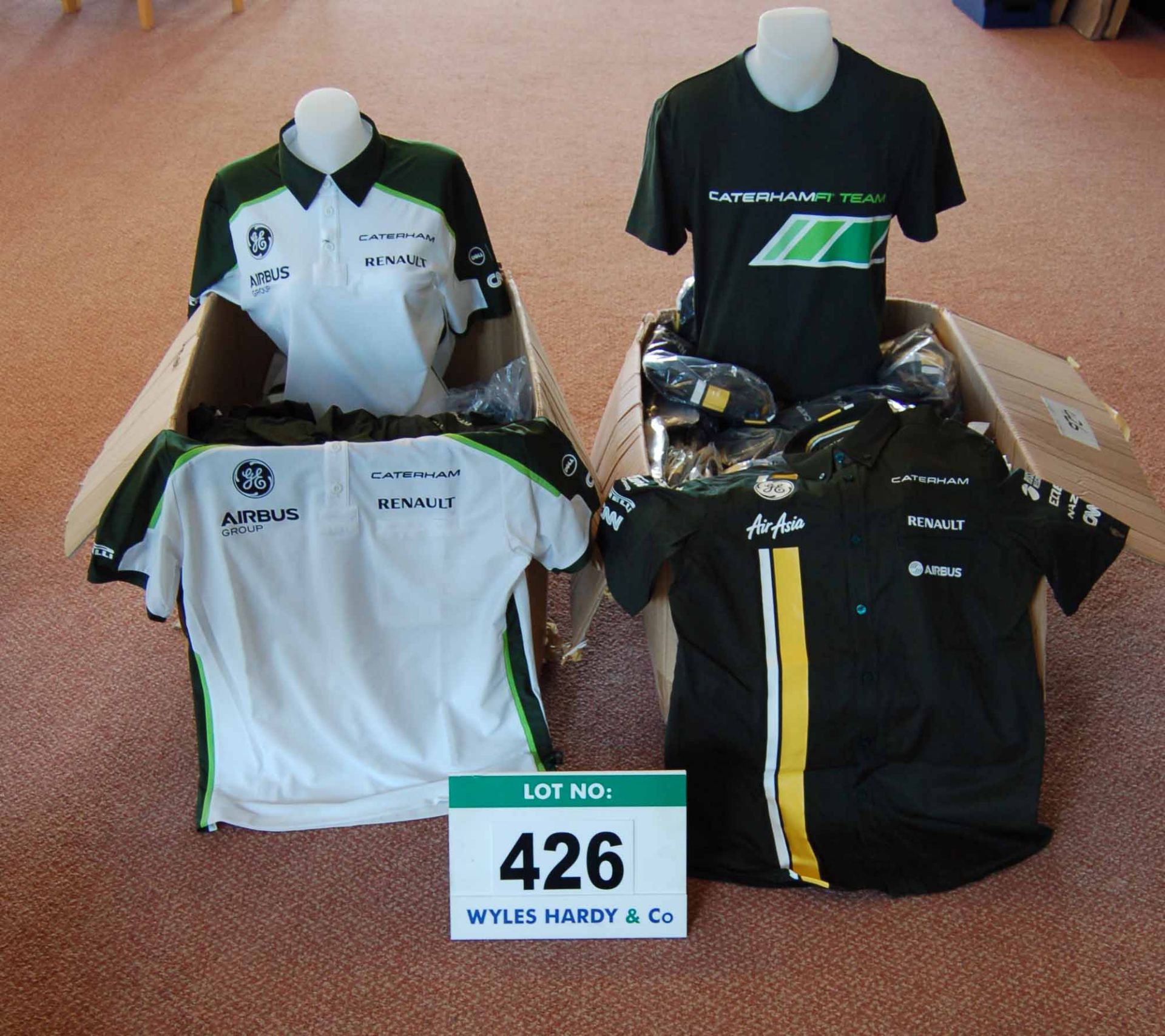 Two Boxes containing Approx. One Hundred & Fifty CATERHAM Team Shirts, Polo Shirts, Socks,