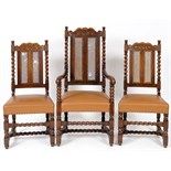 A set of twelve carved oak dining chairs, with cane backs and upholstered seats (10+2) (12)