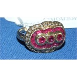 An Art Deco style 9ct gold, ruby and diamond ring