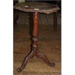 A 19th century carved oak tripod table, 46 cm wide