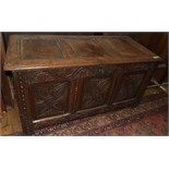 An 18th century carved oak three panel coffer, on stile legs, 123 cm wide Report by NG  Top -