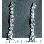 A pair of 18ct white gold and diamond drop earrings, set brilliant and emerald cut stones