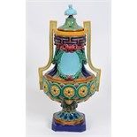 A majolica vase and cover, decorated swags and foliage, probably Minton (a.f.), 57 cm high  See