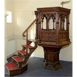 A Victorian Gothic oak hexagonal pulpit, with carved and pierced decoration, incorporating an