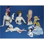 A porcelain half body doll, and five other figures (6)