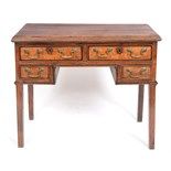 A George III oak lowboy, crossbanded, on tapering square legs, 88 cm wide  See illustration