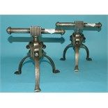 A pair of Christopher Dresser style steel andirons, 17 cm high (2)
