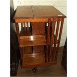 An Edwardian walnut revolving bookcase, 48 cm square