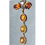 A pair of 9ct gold and amber style stud earrings, and a similar pendant (2)