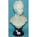 A Parian style bust, of a boy, on a socle base, 38 cm high