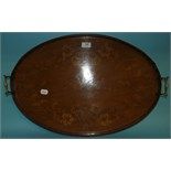 An oval mahogany tray, inlaid with musical instruments and flowers, 65 cm wide