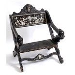 An Italian ebonised chair, with carved and inlaid bone decoration  See illustration