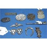 A silver Air Raid Precautions badge, and other silver brooches