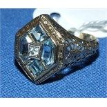 A 9ct gold, blue topaz and diamond ring