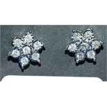 A pair of 9ct gold and diamond stud earrings, in the form of flowerheads