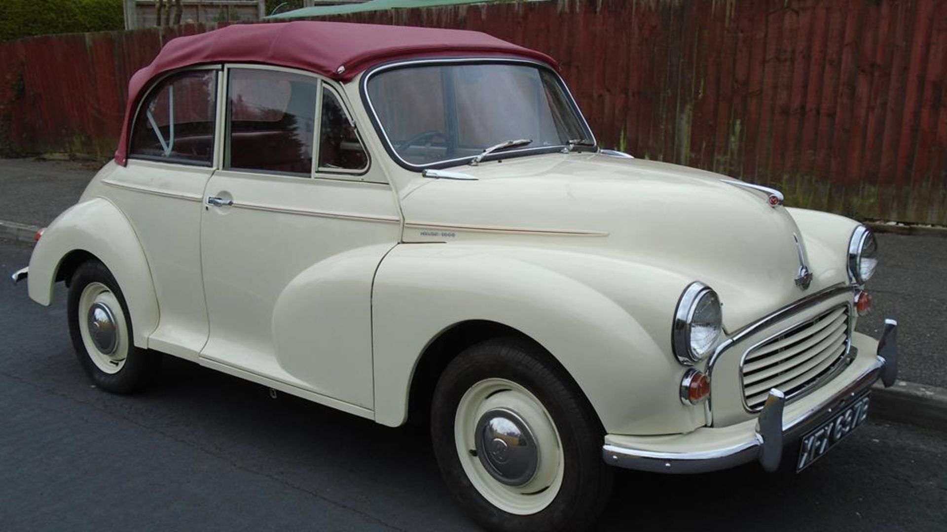 A 1964 Morris Minor replica convertible, registration number XFX 637B, Old English white. This