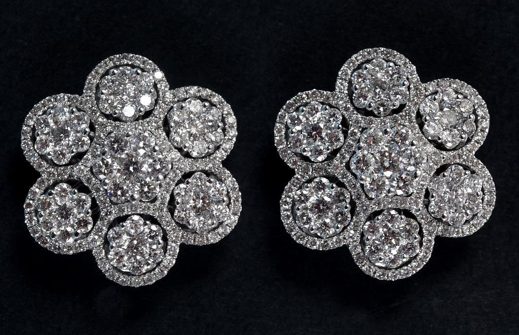 A pair of 18ct white gold and diamond flowerhead cluster earrings  See inside front cover colour
