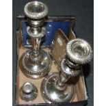 A silver strut photograph frame, Birmingham 1919, 16 cm high, a silver dwarf candlestick,