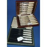 A set of six fruit knives, with mother of pearl handles, and a set of six dessert eaters,