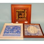 A Victorian pottery tile and two others,