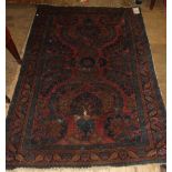 A Persian rug, decorated floral motifs o