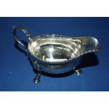 A George III silver sauce boat, crested