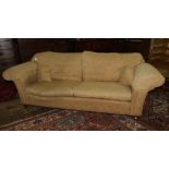 An upholstered three seater settee, with