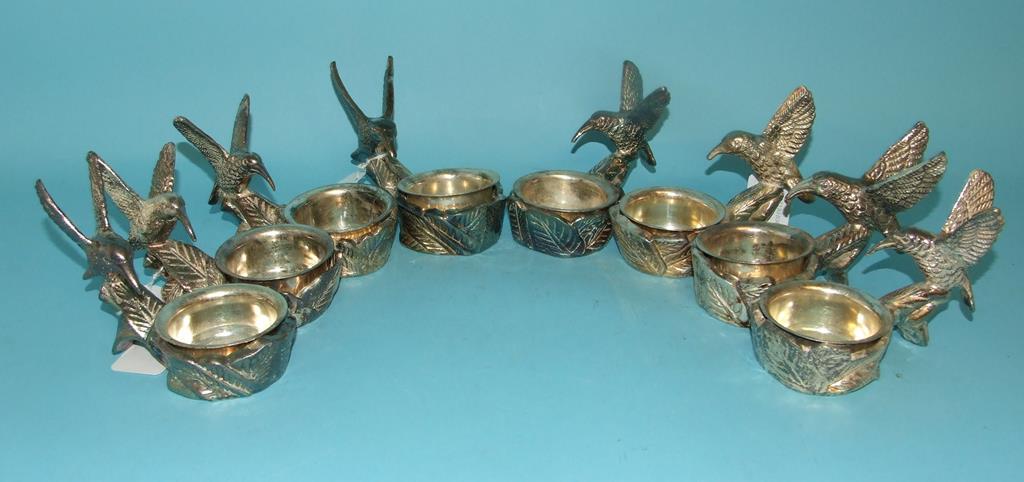 A set of eight silver plated salts, in t