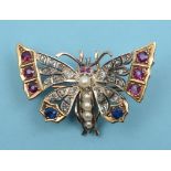 A butterfly brooch, set rubies, diamonds