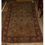 A Persian rug, decorated floral motifs o