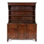 A 19th century oak dresser, the three ti