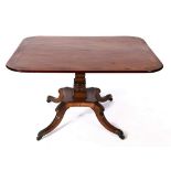 A Regency mahogany centre table, crossbanded in rosewood, on a leaf carved column,
