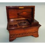A Victorian rosewood tea caddy, of sarcophagus form, with Gothic style carved decoration,