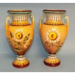 A pair of Doulton faience type vases, wi