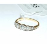 An 18ct gold and five stone diamond ring