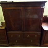 A 19th century mahogany linen press, with two panel doors over three drawers, 140 cm wide