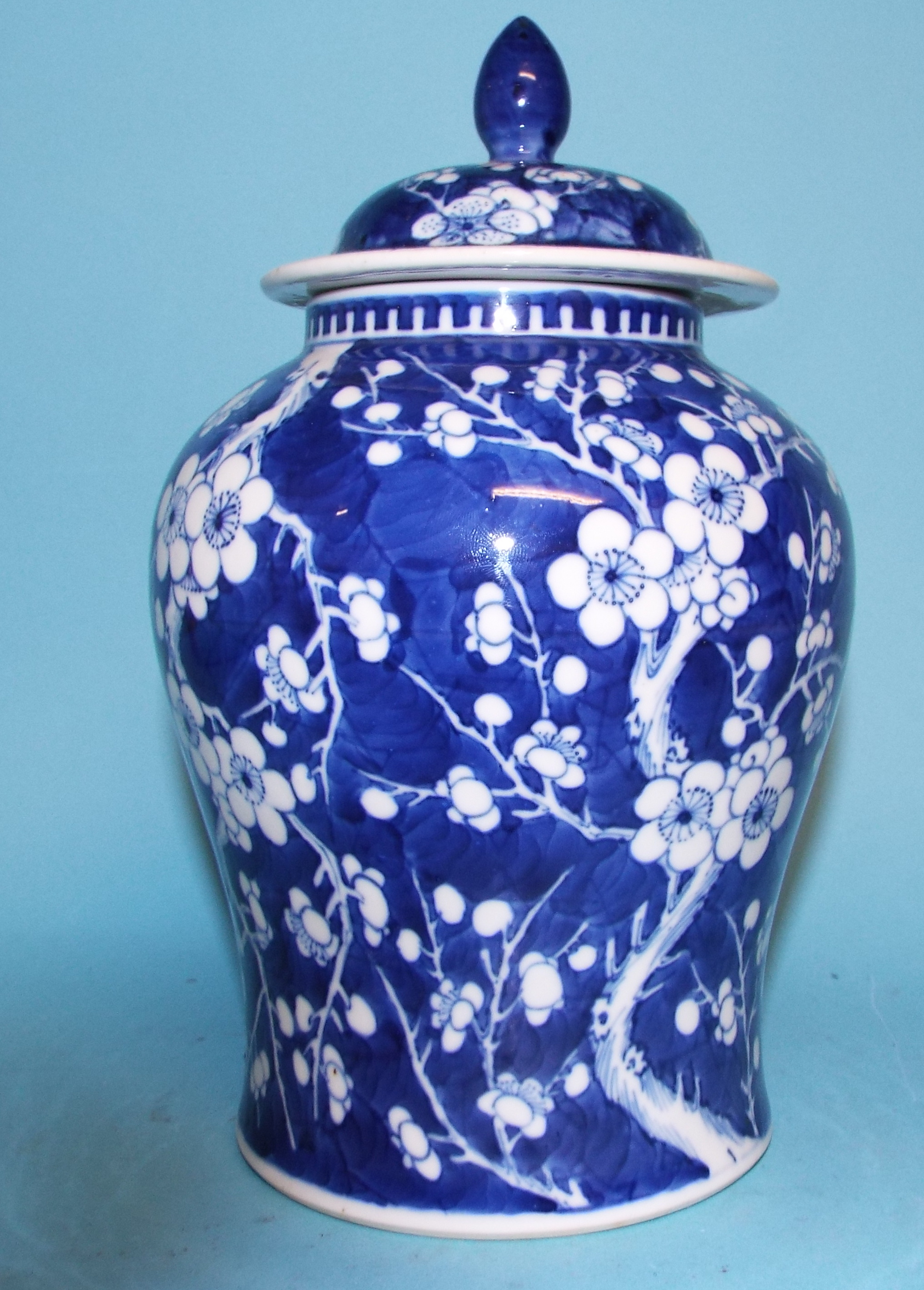 A Chinese porcelain vase and cover, decorated prunus in underglaze blue, 22 cm high, and a similar - Image 2 of 11