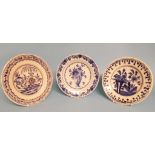 A set of four Delft pottery plates, decorated flowers in a vase, 23 cm diameter, three others,