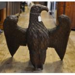 A carved oak eagle, (lacks feet) 60.