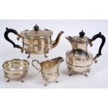 A silver four piece tea service, with lion mask feet, Edward Barnard & Sons Ltd, London 1926 & 27,