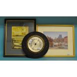 A wall mounted aneroid barometer, in carved oak frame, 29 cm diameter, a wall mirror,