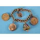 A 9ct chain, applied two sovereigns and two yellow coloured metal charms, approx. 58.