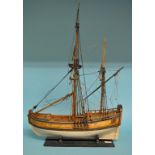 A model of a two masted sailing ship, on wooden stand, 60.5 cm high Condition report Report by GH