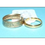 A 22ct gold wedding band, approx. 4.1 g, and an 18ct gold wedding band, inscribed, approx. 8.