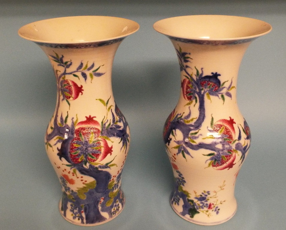 A pair of Chinese porcelain vases, decorated with fruit and foliage, 35 cm high (2) Condition report