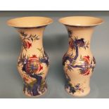 A pair of Chinese porcelain vases, decorated with fruit and foliage, 35 cm high (2) Condition report